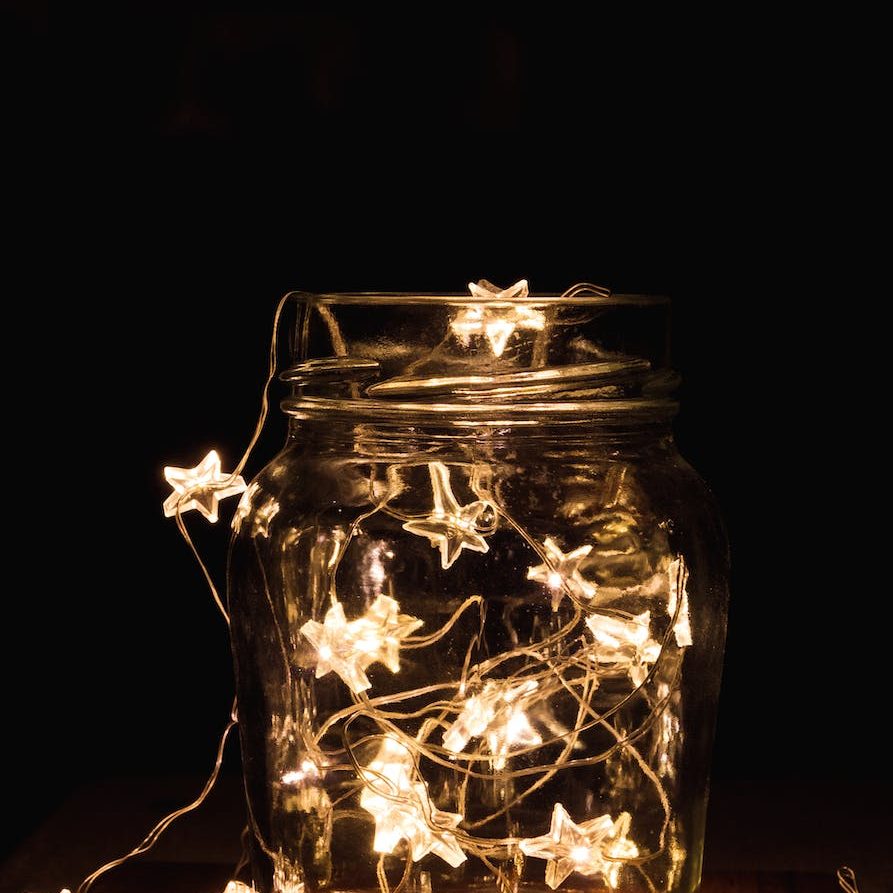 clear glass jar with string lights
